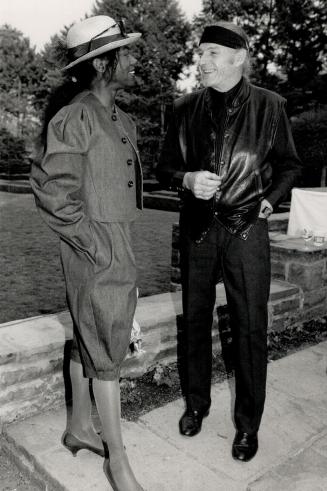 Singer-actress-dancer Lili Francks, in an outfit of her own design, shares a moment with her husband, actor Don Francks, wearing his usual headband and black leather jacket