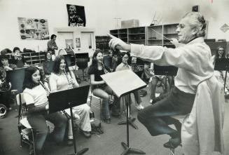 Toronto composer Harry Freedman conducts one of his works at North York's Don Valley Junior High School