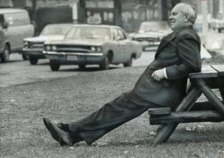 Douglas Fullerton, chairman of the National Capital Commission in Ottawa, lounges on a bench in Queen's Park amid the traffic. Fullerton, the man who (...)