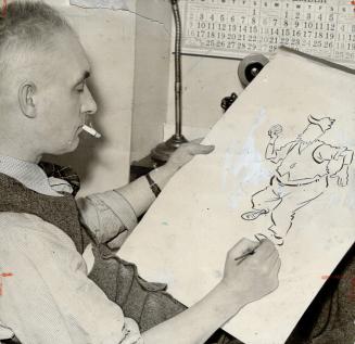 Noted Canadian cartoonist, James Fris seen at his drawing board, died Sunday