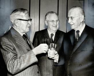 At a testimonial dinner for J. A. Kennedy, retiring head of the Ontario Municipal Board, in November, 1972, Frost, right, chats with Kennedy, centre, (...)