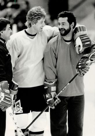 Happy Oilers: Centre Wayne Gretzky, left, and goalie Grant Fuhr, who starred against the Soviets, enjoy a little joke during a light workout of the National Hockey League All-Stars yesterday