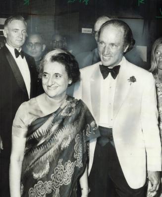 Two Prime Ministers - Indira Gandhi of India and Pierre Trudeau of Canada-walk through the lobby of the new $3 million Shaw festival Theatre at Niagar(...)