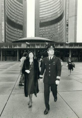 Earth-bound astronaut. Marc Garneau, Canada's first man in space, and his wife, Jacqueline, gaze wistfully skyward after a meeting with Toronto Mayor (...)