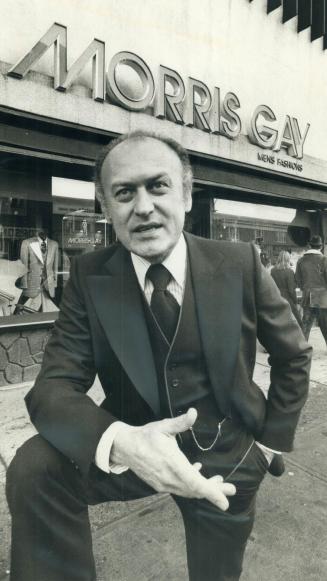 Fed-up retailer Morris Gay, shown in front of eglinton Ave