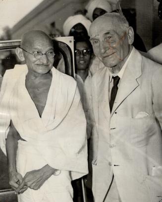 Man of peace, Mohandas K. Gandhi today was shot to death by a Hindoo assassin, one of the millions he led to independence. He is seen with Lord Pethick-Lawrence