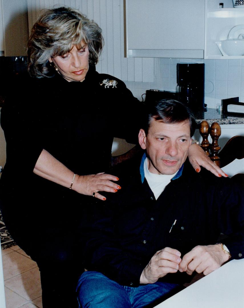 Waiting over: Police board member Norm Gardner relaxes at his Thornhill home with his wife Gail last night on hearing he will not be charged over shooting a robbery suspet in his North York bakery