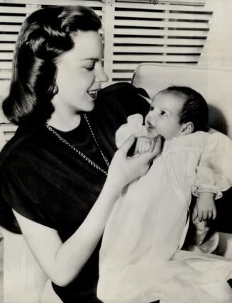 Scene-stealer in the Hollywood home of Judy Garland is daughter Liza who is now two months old