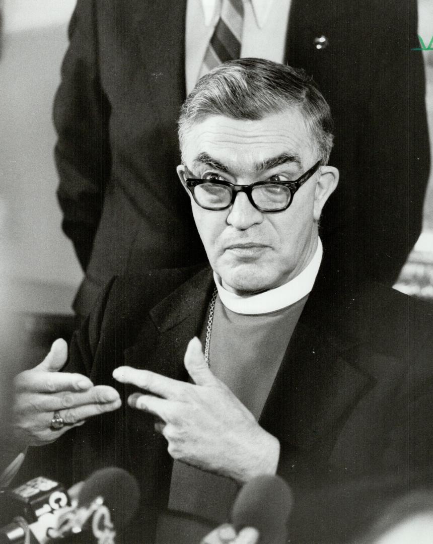On the attack: Most Rev. Lewis Garnsworthy, Anglican Archbishop of Toronto, gestures at press conference yesterday, accusing ex-premier Bill Davis of governing by decree