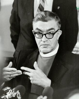On the attack: Most Rev. Lewis Garnsworthy, Anglican Archbishop of Toronto, gestures at press conference yesterday, accusing ex-premier Bill Davis of governing by decree