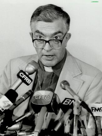 Skeptical: Toronto Anglican Archbishop Lewis Garnsworthy tells news conference yesterday he fears Roman Catholics will now build worship centres instead of schools