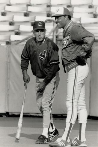 Talking it over: Interim Jays manager Cito Gaston, right, has a talk with coach Jim Davenport of the Indians prior to last night's American League game at Exhibition Stadium