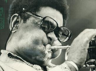 Blowing some hot Jazz, trumpet player Dizzy Gillespie thrilled the crowd Saturday and Sunday at Varsity Stadium during two-day festival. The fans esti(...)