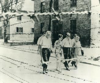 Givens sees Nazi Death camp. Toronto Mayor Philip Givens and his wife visit Auschwitz, the Nazi concentration camp, during their trip to Poland. At le(...)