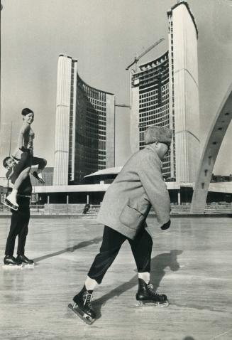 Graceful about it all, Mayor Philip Givens skims across the ice as skating champions and ice revue stars Otto and Maria Jelinek have a workout at the (...)