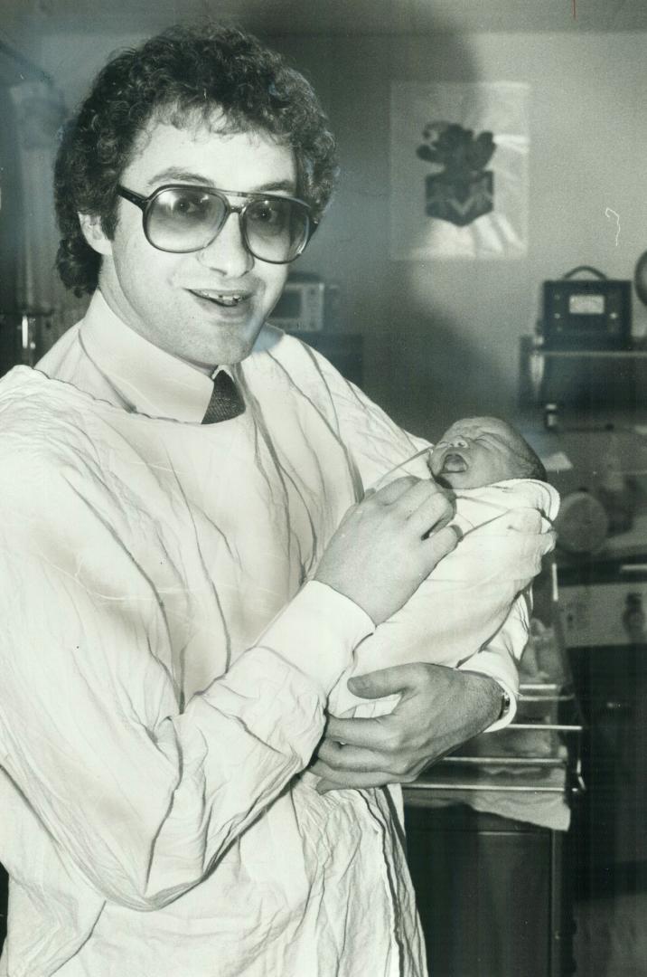 Howling success: Brand-new Joshua Jay Godfrey, who weighed in at 5 pounds, 14 ounces yesterday, doesn't seem too happy at his dad's choice of a baseball career for him