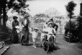 Denis, Adrian and Jean (Billie) Conan Doyle with attendant adults at the London Zoo, July 1914