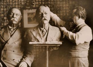 Jo Davidson works on his bust of Arthur Conan Doyle