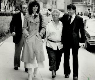 Entering court: Tom Skinner, 64, (left), Patricia McGonegal, 33, and Wayne Skinner, 38, (with arm around relative), enter courthouse yesterday to attend their sentencing on fraud charges