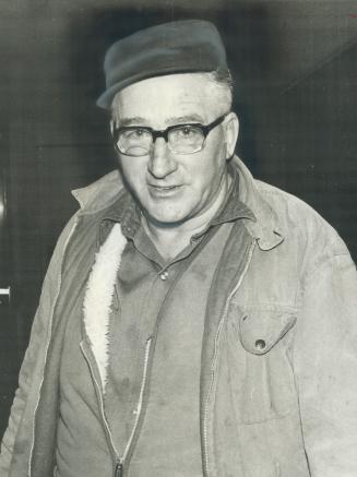 Lee Matthews of Port Burwell leaves the building where hijackers dumped him after stealing his truck loaded with 317 cases of cigarettes. Matthews was(...)