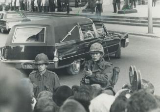 Days of terror: Canadian soldiers guard the funeral cortege of Quebec Labor Minister Pierre Laporte, murdered by FLQ terrorists
