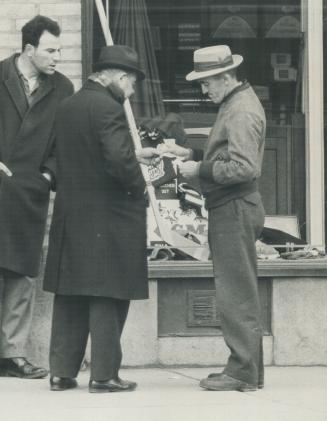 Charlie Brenay (right) Hands Over $15 To Scalper for A Hockey Ticket, Star's Reg Innell photographed actual changing hands of money and ticket