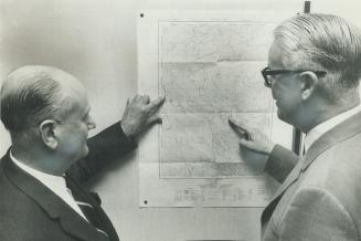 Harold Graham (left), Bernard Simmonds plot moves on map