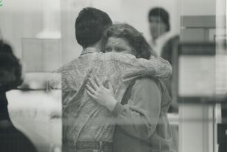 Employees, pictured through the window of the Royal Bank branch at Markham Rd