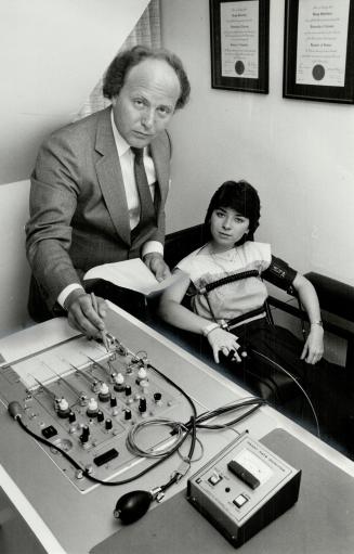 Toronto Polygraphist, Dr. Ben Silverberg demonstrates the use of a lie detector