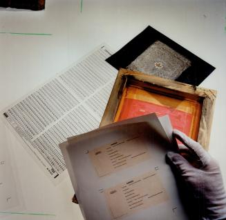 Left behind: A negative, silkscreen stencil and the resulting page were found in the forgers' apartment