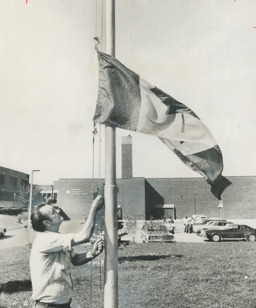 The flag flew at half-staff today at Centennial Secondary School in Brampton, where a youth yesterday killed a fellow student and a teacher and wounde(...)