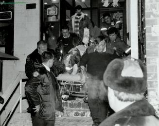 Man shot in Chinatown, A man is carried from theTin Tin Restaurant, on Dundas St