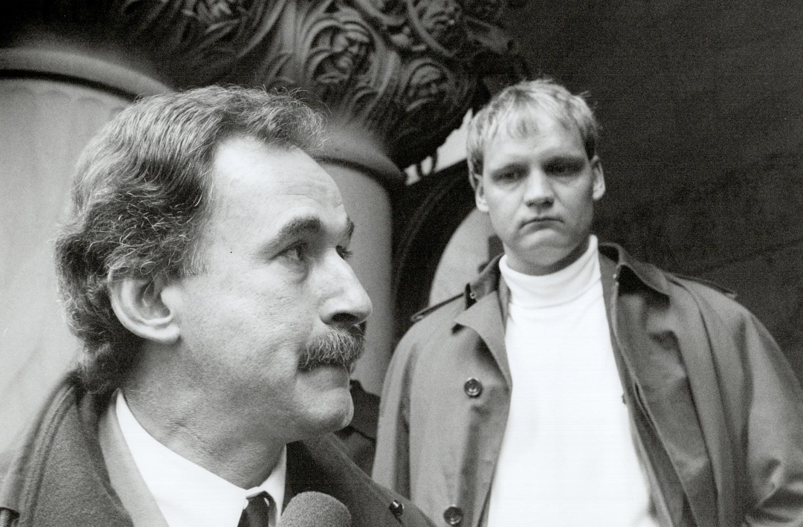 Pensive moment: Alleged victim Martin Kruze, right, listens yesterday as Metro police Detective Dave Tredrea discusses the Gardens investigation