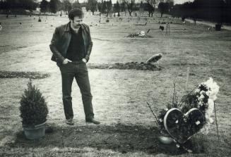 Father's agony: Stan Lukow stands at the grave of his daughter Terri