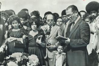 Pastor C. S. Greene leads the graveside service at the funeral for slain Michael Habbib. That he was black is unimportant, but that one of our young c(...)