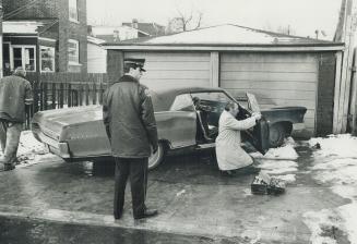 Detectives check the car in which Rene Vaillancourt fled after killing Constable Leslie Maitland, above, during a 1973 robbery