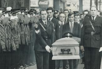 Pallbearers were policemen at the funeral of Constable Leslie Maitland, killed in 1972 while questioning a bank robbery suspect