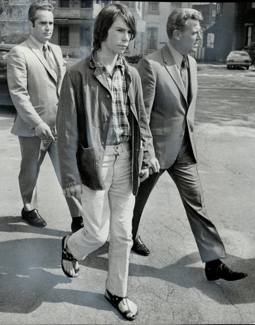 David Thurston flanked by detectives, Winston Weatherbie (left) and George Thompson