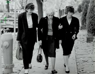 Grieving Grandmother: Ruth Windebank's mother, centre, is aided by two women outside the funeral home