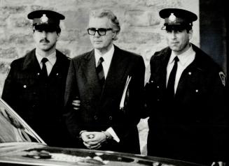 Trial takes toll: Peter Demeter, escorted by police officer during his recent trial, was a pale image of his former self after his arrest on charges of plotting to kill his distant cousin