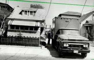 Police probe triple slaying, Homicide detectives and uni- formed policemen swarm about an East York house where the bodies of three men stabbed to death were found today