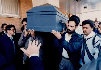 Last ride: Pallbearers carry the remains of Baljeet Singh in a small chapel at Glendale Memorial Gardens