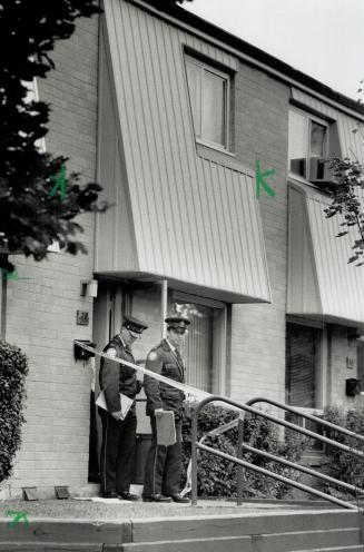 Murder scene: Police officers stand in front of the Morecambe Gate townhouse in Scarborough where a teenager was shot to death at a crowded house party