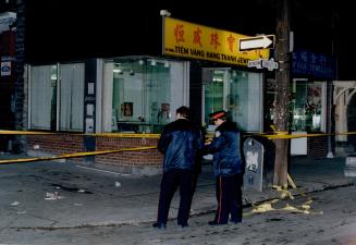 Shooting scene: Police examine the scene of an attack in Chinatown earlier this year