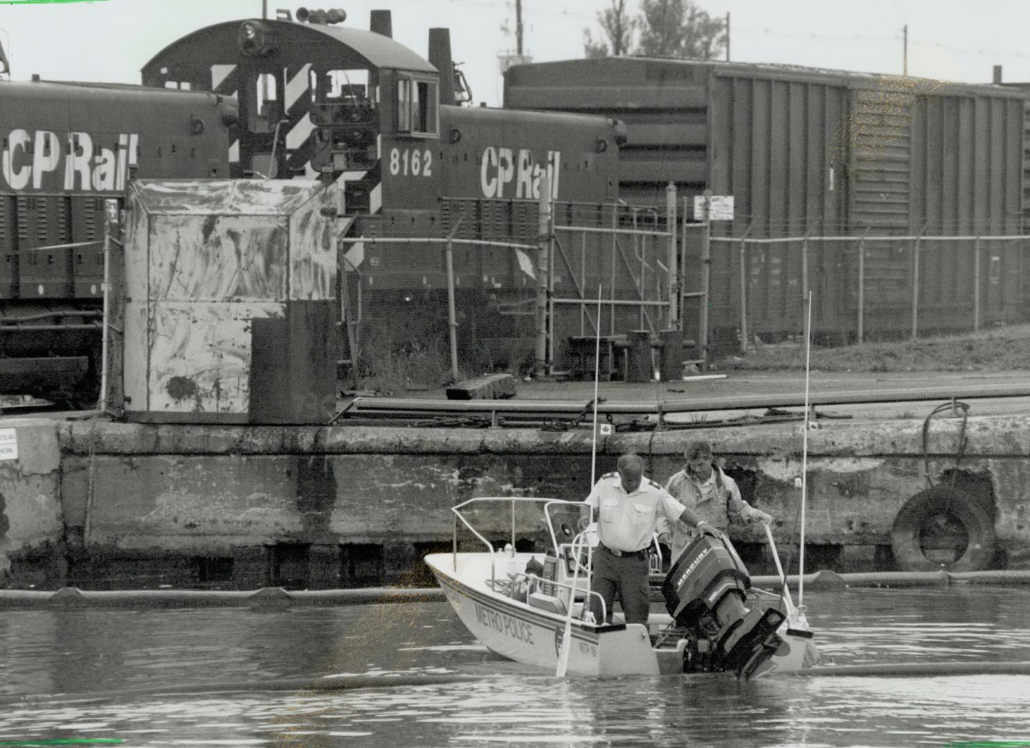 Water tests: Metro police officers conduct tests in the area where the body of 3-year-old Kayla Klaudusz was found by two railway employees on Friday