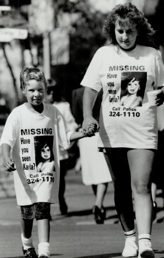 Spreading the word: Shannon Holloway, 8, of Port Credit and Keri Lee Deon, mother of missing Kayla Klaudusz, wear T-shirts printed to aid the search