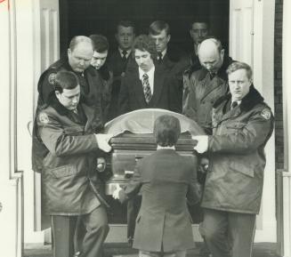 The casket of slain police constable Michael Sweet is carried from a Scarborough church today