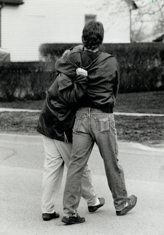 Day of grief: A sobbing teenage girl clutches a friend's shoulder after learning that French's body had been found