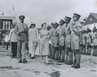 Princess Margaret inspects an honor guard composed of a volunteer defence force at St