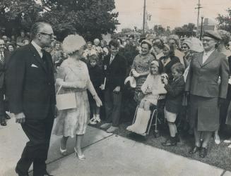 A favourite of children: The Queen Mother began the first full day of her five-day visit to Toronto with a morning visit (above) to Sunnybrook Hospital